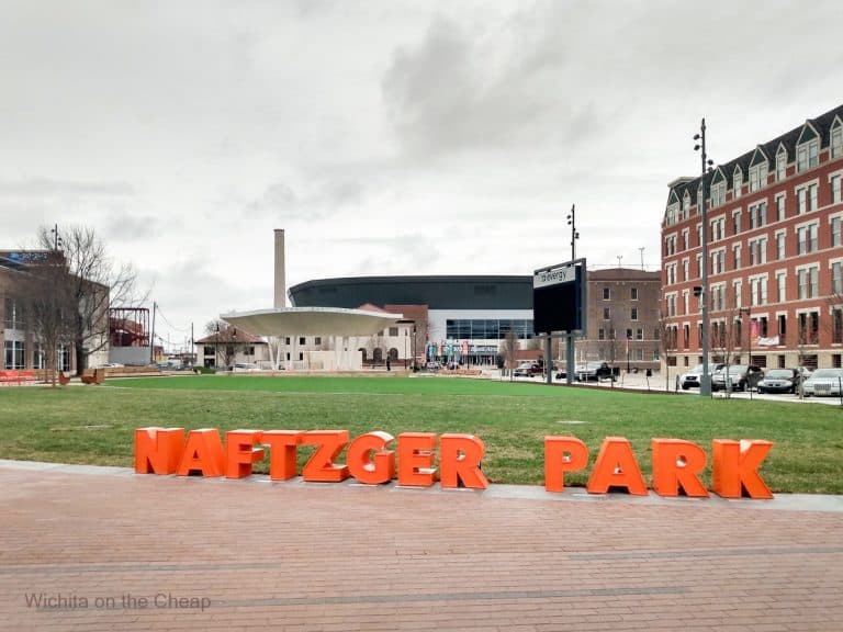 Naftzger Park letters lining the curved edge of the green mall area of the park downtown in Wichita