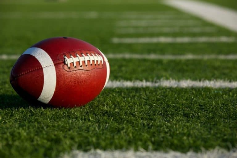 Football on a field marked with yard lines